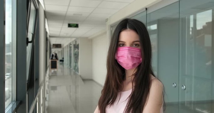 young girl in hospital in a mask