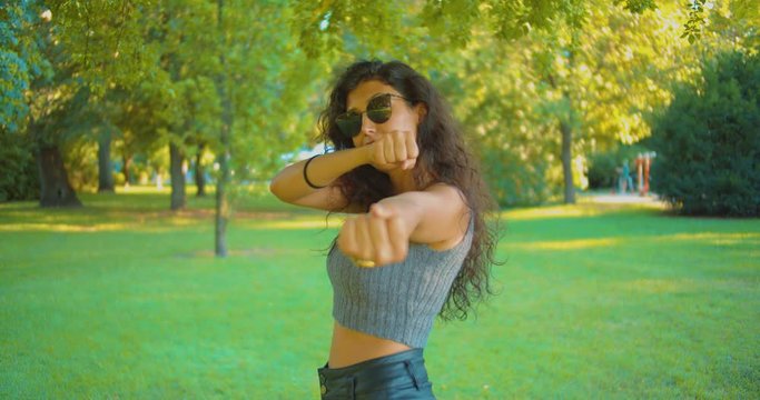 Portrait of Sexy Young Female With Sunglasses Showing Middle Finger on Funny Way