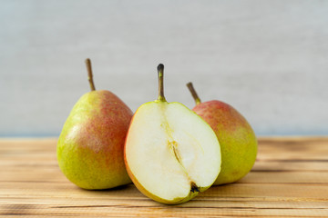 fresh juicy delicious pears on a wooden background