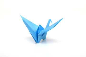 Naklejka premium Blue origami bird on white background