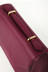 handbag on a white background.
