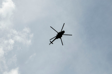 helicopter against the blue sky