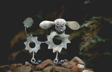 Illustrated silhouette of a poodle dog on a dark background