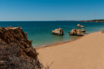 Da Rocha beach. Praia da Rocha is one of the wonders of the Algarve, Portugal, a beach with huge rocks in the water, with cliffs, caves ...