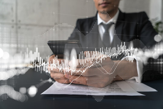 Trader in office working with Smartphone, FOREX graph hologram to analyze market behavior, typing phone. Double exposure.