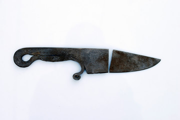 Broken forged knife on a white background.