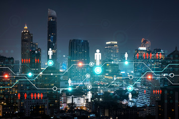 Glowing Social media icons on night panoramic city view of Bangkok, Asia. The concept of networking and establishing new connections between people and businesses. Double exposure.