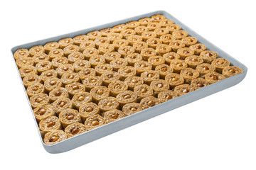 Turkish baklava, oriental sweets on a metal tray, isolated on white background. Horizontal format.