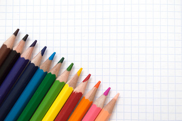 Fototapeta premium Colorful pencils Multicolored Pencils on school notebook