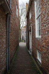 Fototapeta premium Traditional Dutch Houses in an Alley in Veere, Zeeland, Netherlands
