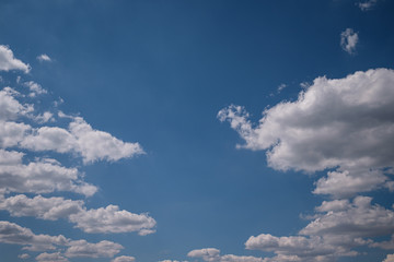 Blue summer sky with white clouds