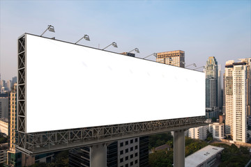 Blank white road billboard with Bangkok cityscape background at sunset. Street advertising poster, mock up, 3D rendering. Side view. The concept of marketing communication to promote or sell idea.