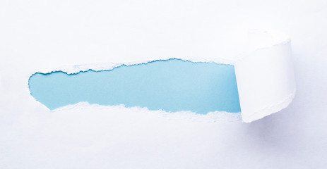 white torn paper. inside blue copy space