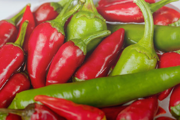Group of Red hot chilli peppers close-up on a dark backgroundм