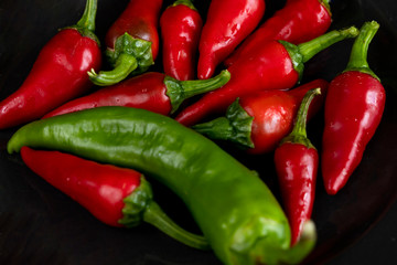 Group of Red hot chilli peppers close-up on a dark backgroundм