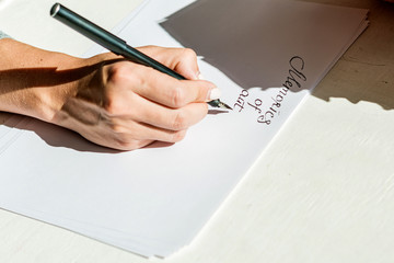 Handwritten text on a white sheet of paper.