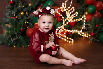 little girl with christmas tree
