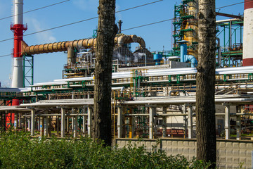 an oil refinery with industrial structures outdoors against a blue sky and space for copying in Yaroslavl Russia