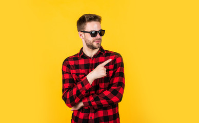 Obraz premium Young and carefree. cheerful and stylish. handsome man in sunglasses. indoor portrait of sexy european businessman. confident and calm. handsome casual man standing with beard and bristle