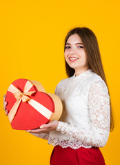 happy valentines day. teen girl hold heart shape box. love and romance. kid with gift. shopping on holidays. time for presents. happy birthday. child with box. best present ever. be my valentine