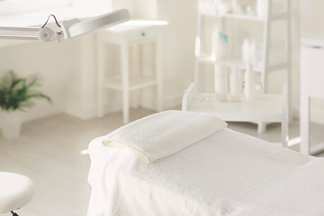 The interior of the beauty salon. Workplace of a cosmetologist maasagist. White dermatologist...