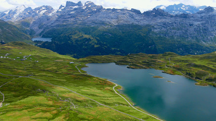 Naklejka na ściany i meble Wonderful Mountain Lake in the Swiss Alps - aerial view - travel photography