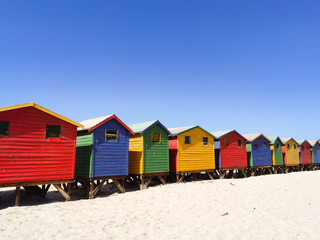 Fototapeta na wymiar colorful beach houses on the beach at Muizenberg side perspective- South Africa, Eastern Cape