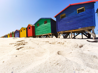 Naklejka premium colorful beach houses on the beach at Muizenberg in side perspective - South Africa, Eastern Cape