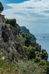 Fototapeta na wymiar Evocative view of the Amalfi coast. Landscape. views of the rocky hills overlooking the sea and wild vegetation.
