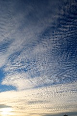 gorgeous sunset with cotton-like polka dot blur clouds