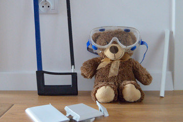 Sweet teddy bear worker with glasses and a saw.