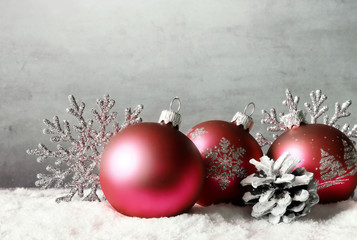 Christmas balls and snowflake on winter background.