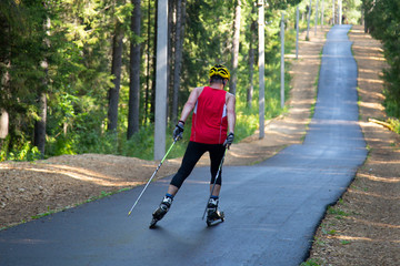 Man cross-Country skiing with roller skis in the Park