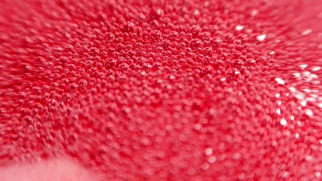 Raspberry syrup. Pink background with bubbling bubbles and raspberries.