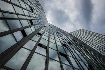 modern office building with storm clouds