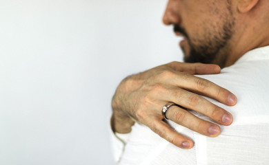 Hand of young white man with a beard with a titanium ring and a cut diamond. Jewelry for men. Engagement ring.