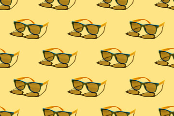 Multicolored sunglasses seamless pattern on pastel yellow background. Minimal summer concept. Trendy sunlight summer pattern.