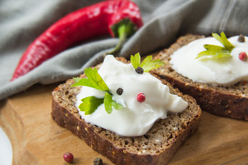 Delicious bread with spices, chili peppers, herbs and cheese cream