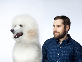 family photo of a pet dog and a beautiful young man.