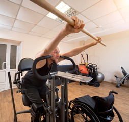 Fototapeta na wymiar Disabled man training in the gym. Rehabilitation center