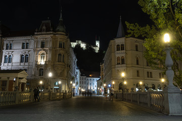 Fototapeta na wymiar Old center of Ljubljana by night and the view at the castle