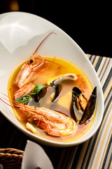 Bouillabaisse fish soup with prawns, mussels, tomato ,lobster and squid. Traditional in France,...