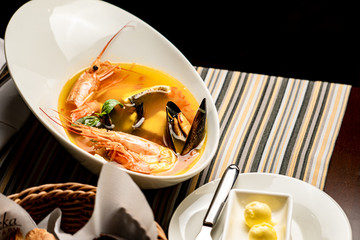 Bouillabaisse fish soup with prawns, mussels, tomato ,lobster and squid. Traditional in France,...