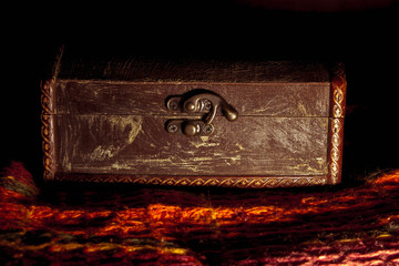An old box, the lid of the chest closed.