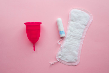 Menstrual cup and disposable pad and tampon. Reusable menstrual cup is an alternative to disposable tampons.