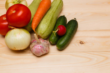 Autumn cooking background with seasonal organic vegetables on wooden table, top view, copy space. Ingredients for autum seasonal soups and dishes.
