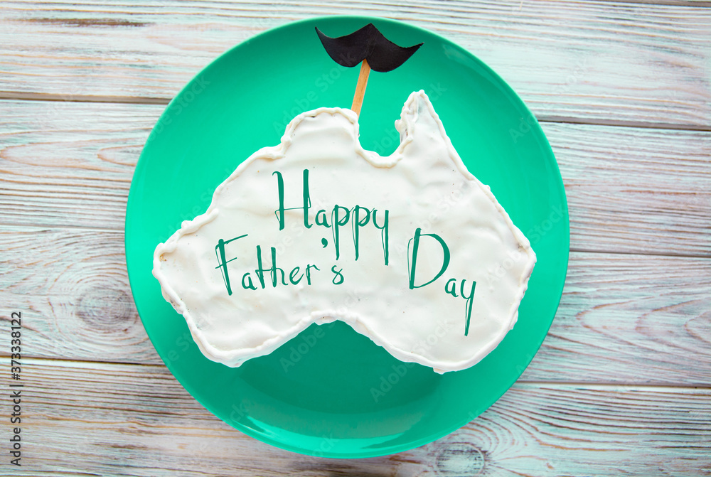 Wall mural vanilla cream cake in a shape of the Australia message greeting card, with mustache, father's day gift	 - Wall murals