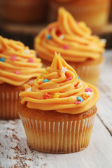 Cupcakes with orange icing on top