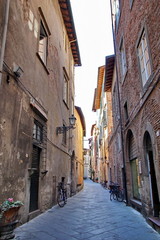 Narrow residential street in the historic part of Lucca, Italy