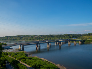 A wide river in Central Siberia. Clouds reflected in the water and beautiful shores.